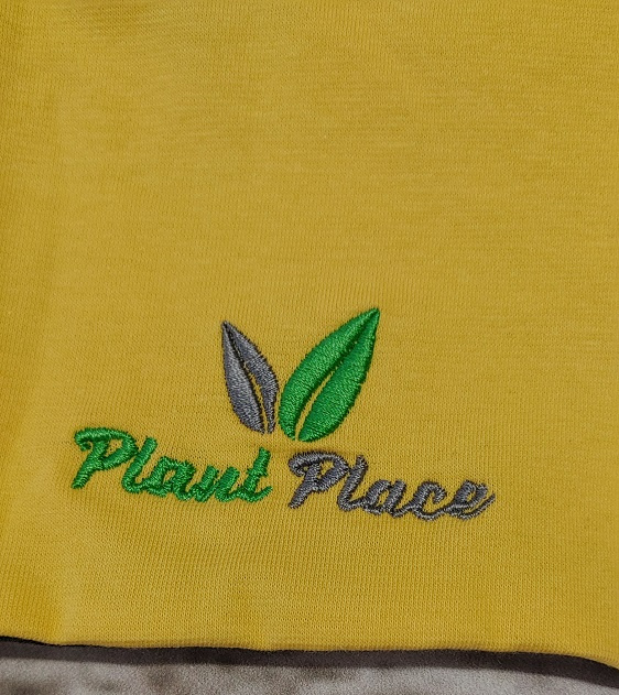 Two-layer cotton hat in yellow-graphite color.