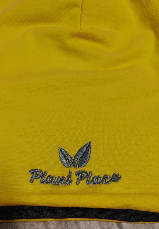 Two-layer cotton hat in yellow-graphite color.